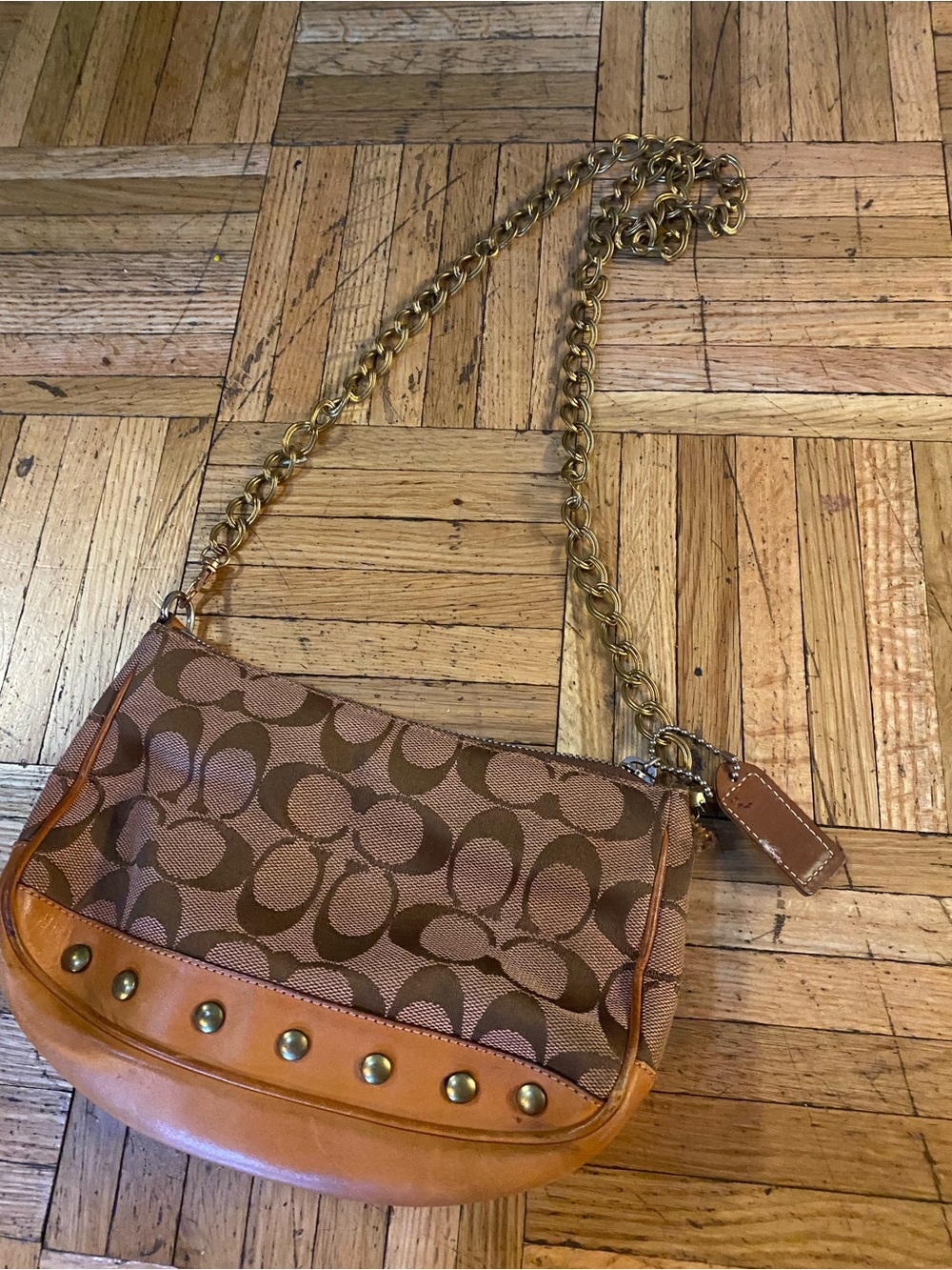 Trendy Coach authentic bag with chain should strap.